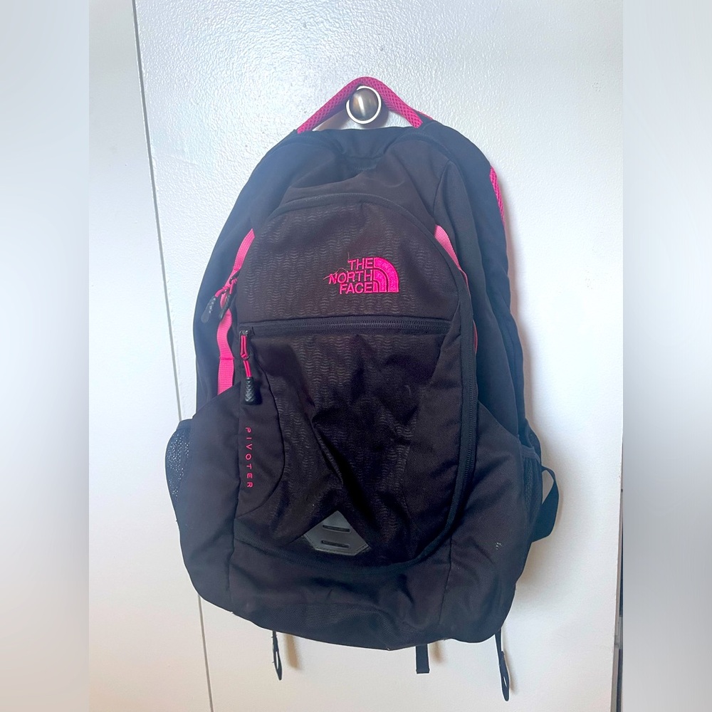 Black north face backpack with pink accents